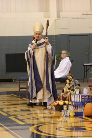 Bishop Dale Melczek thanks the Noll community for the food donated to St. Josephs soup kitchen