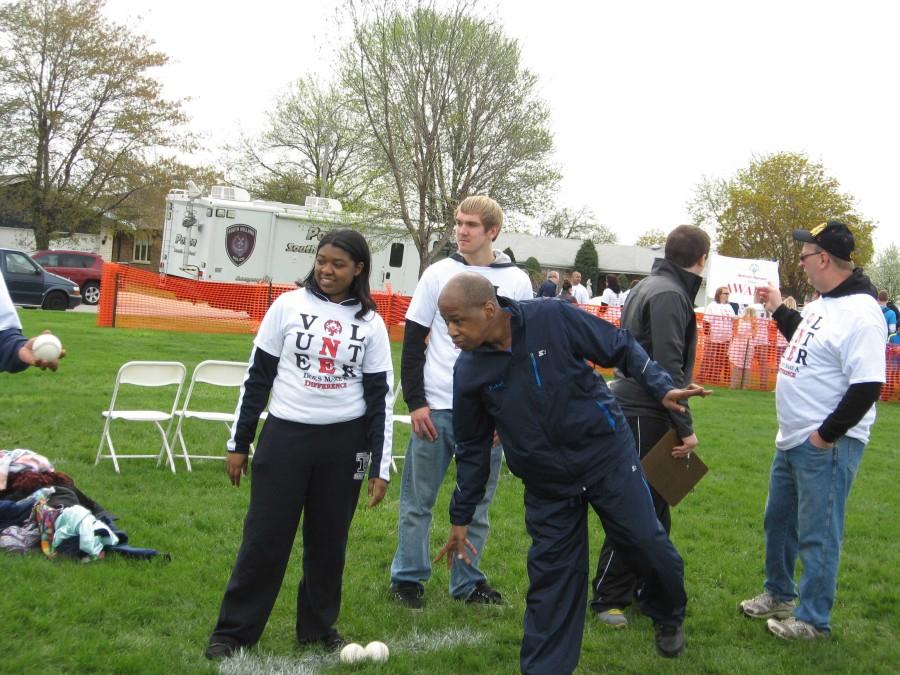 Senior Shannon Figueroa volunteers with a Special Olympics participant. 