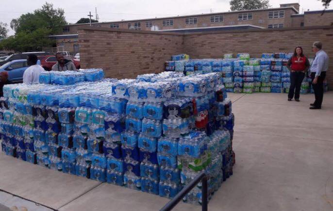 Bishop Noll seniors load up water to donate to East Chicago.