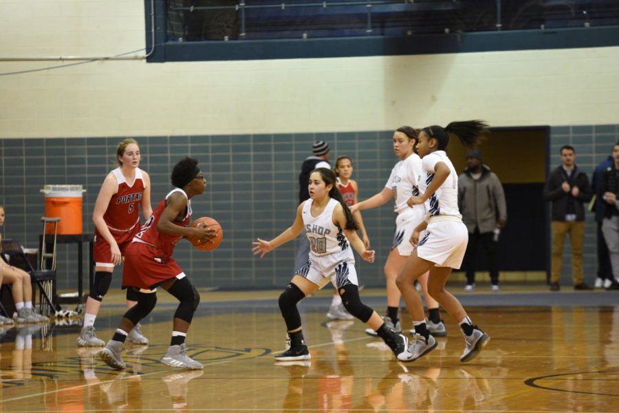 Freshman Brianna Gonzalez joins senior Courtney Blakely and sophomore Danneli Campbell in trapping a Portage High School defender on Nov. 26 at Bishop Noll. 