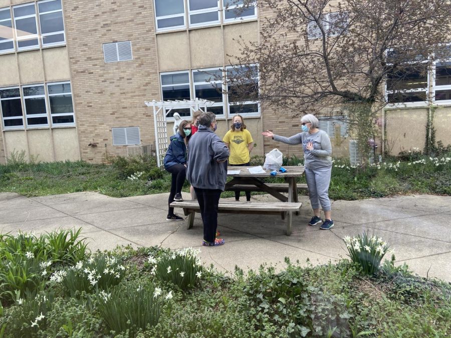 The environmental club meets in the courtyard to decide how to clean it up. The group decided to to clean the courtyard as one of their projects for the upcoming Earth Day. 