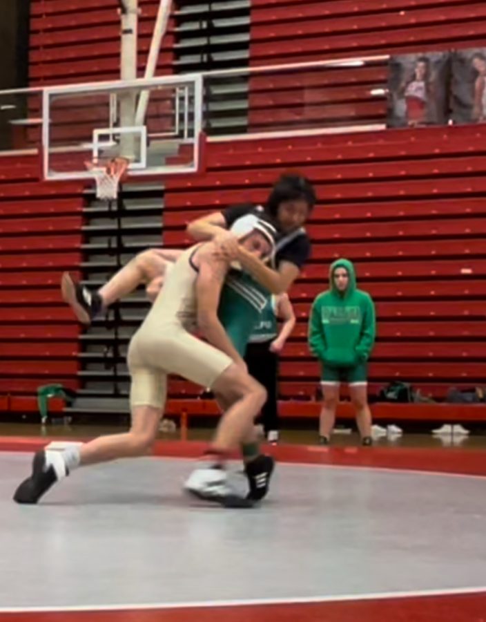 Freshman Sebastian Zuwala grapples an opponent from Valparaiso before the pin to win the match. The freshman rookie went to sectionals last month. 
