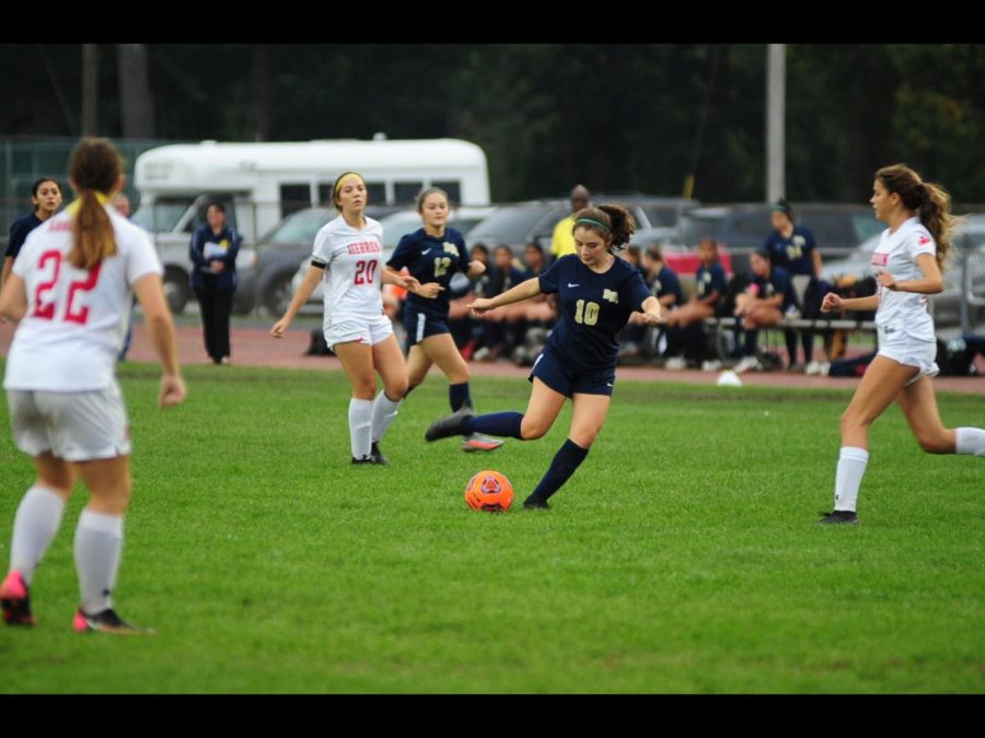 Kicking into success
During game time against Hebron High School, Ariana Magallanes being on offense, kicks the soccer ball. In order to score a goal, she passed the ball to one of her teammates on October 8, 2021 on Hebron’s soccer field. 