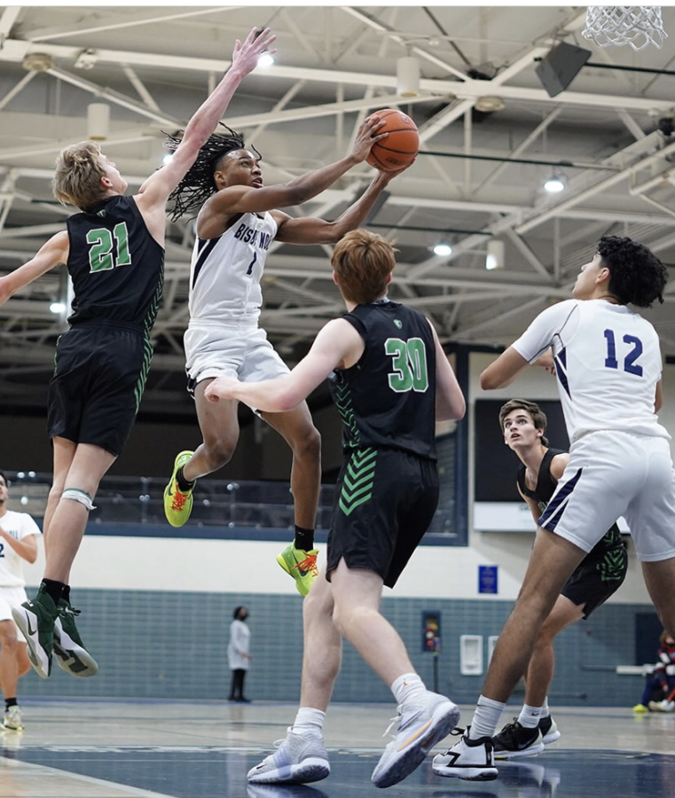 Airborne. Artis shoots for one of his two three-pointers in a Jan. 22 win against Whiting at Noll. 
“This rivalry game was long awaited and I think the liveliness we got from the student section really encouraged us to play harder this game”, said Artis.