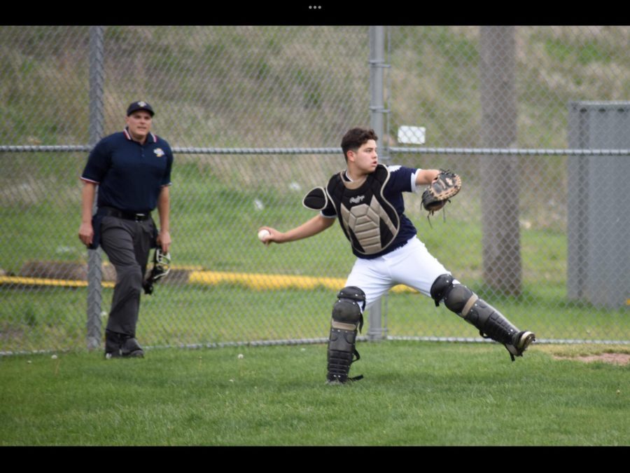 Senior catcher Ethan Lopez retrieves a stray pitch and throws to 2nd during a game against Hanover central. The Warriors will start their season on March 22nd. 
 
