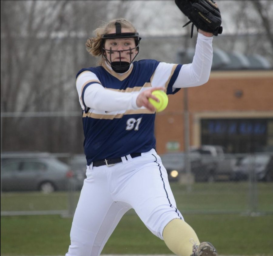 Freshman Molly Whelan throws her first ball of the season on Tuesday, April 5. Whelan started her freshman season playing for the Lady Warriors.