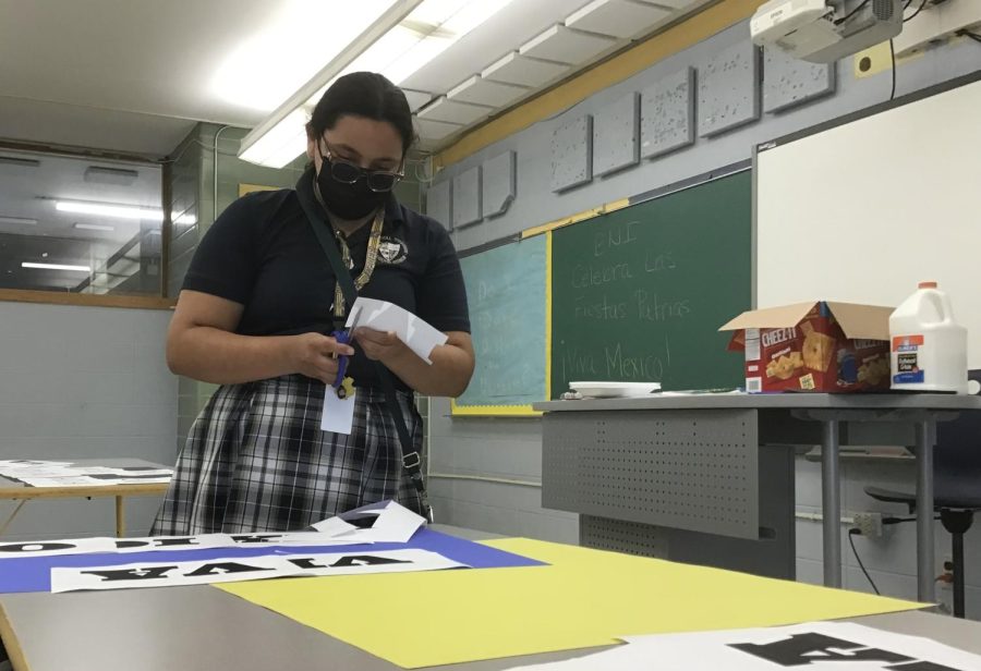 Hard At Work: Senior and Founder of HSU, Sophia Mendez carefully cuts out poster decorations for a Hispanic heritage project in a school classroom on Sept. 23. “ Being a part of the HSU does bring me closer to my culture. It opened the door for me to know more about my culture,” says Mendez. 
