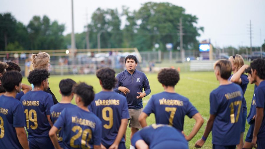 Pep Talk: Head coach, Edin Galvez, rallies up his team on the field to offer some motivation at a BNI home game. 