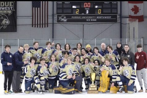 The boys strike a pose on the ice after winning the 2022-23 season Roper Cup. “This is all really exciting, but being a senior I do feel a sadness knowing this is my last year to experience this,” says Figueroa. 
